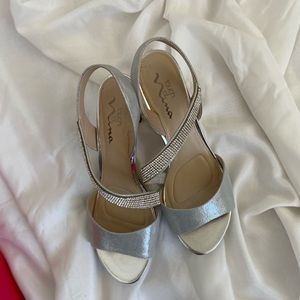 An elegant silver sandals brand new